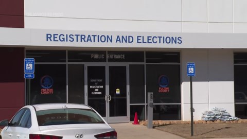 FBI agents with warrant search Fulton County elections office near Atlanta