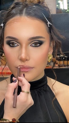 Joelle Berri 💋 on Instagram: "Smokey glow-up🖤 - - EARRINGS @bardugold.lb SKIN PREP: @nadine.njeim.beauty SKIN BASE: @makeupforever @makeupforevermea CONCEALER: @hourglasscosmetics FULL CONTOURING using HD foundation palette @makeupforevermea @makeupforever Lip combo @maccosmeticsmiddleeast @maccosmetics GELLINER @inglot_lebanon MODEL: @lalalandmalee HAIR @ali_houranyy @bashir.hairstylist LENCES @bellacontactlenses @bellacontactlenseslebanon in shade ( Vivid Grey)"