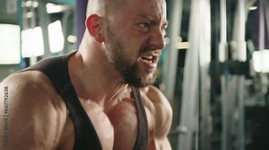 professional bodybuilder training chest muscles using cross over machine slow motion. . High quality 4k footage