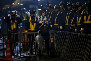 Japan passes controversial law to nix military limits