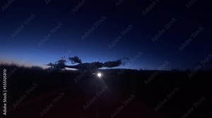 Abstract light trails and flashes made from long exposure time lapse from the perspective of the rear window of a car while driving