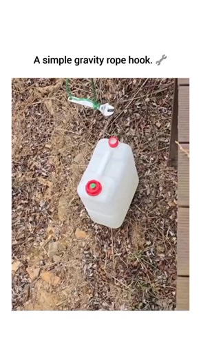 MOJO GOOFI on Instagram: "Forget complex hardware—sometimes all you need is a wrench and a bit of physics. This viral demonstration showcases a brilliant “gravity rope hook” in an outdoor setting, turning basic mechanical principles into a functional lifting tool. The process starts with a simple rope loop threaded through the handle of a heavy plastic jug. Instead of tying a knot, a metal wrench is placed through the loop. As tension is applied by pulling the rope upward, the wrench acts as a h