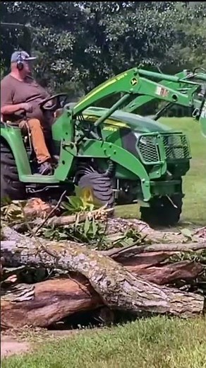 Piling Brush - John Deere 3039r and Frontier Root Grapple