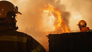 Firefighters putting out a fire house burns flame professional teamwork firefighter saving lives rescuing people pets fireman extinguishing flames hero adult extreme heat security risk