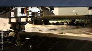 Robot for stamping metal products during work. Modern automated factory