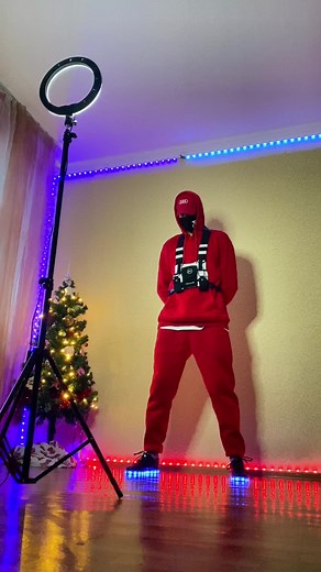 Checkmate: Stylish Red Tracksuit and Creative Lighting