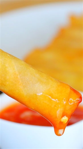 Filipino Fried Spring Rolls (Lumpia)! 📝Full Video Printable Recipe: https://cicili.tv/filipino-fried-spring-rolls-lumpia/ Serves: 40 Prep time: 1 hour and 40 minutes Cook time: 25 minutes For the sweet chili dipping sauce: 1 cup water 3 tablespoons rice vinegar 3 tablespoons ketchup 3 tablespoons sugar 1 tablespoon sambal oelek 3 garlic cloves, minced 1 tablespoon cornstarch 3 tablespoons water For the Filipino Fried Spring Rolls: 1 1/2 pounds ground pork 1 large carrot, minced 1 medium yellow 