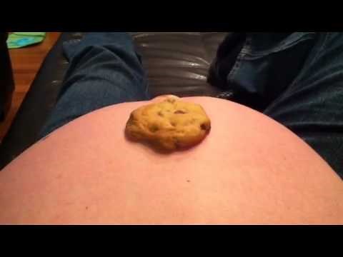 Baby in womb kicks cookie into mama's mouth