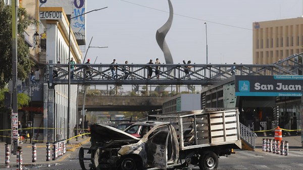 Security forces keep up fight with cartel gunmen a day after the Mexican military killed a drug lord