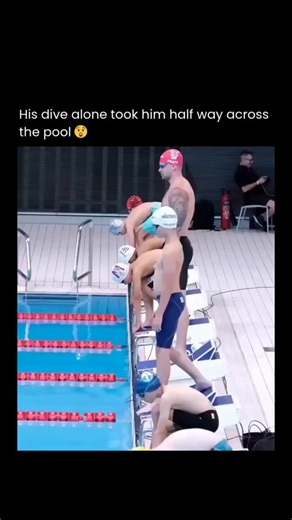 Explaining Everything | Facts | History on Instagram: "In a stunning display of pure athleticism, one swimmer's powerful dive launches him nearly halfway across the pool before he even starts swimming, leaving his competitors far behind. This incredible where Olympic swimmers race amateurs with a head start at the Sandwell Aquatics Centre in the UK is the explosive starting technique that separates elite swimmers from the rest, turning the initial dive into a massive competitive advantage. This 