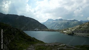 Aerial approach of Hotel Grimsel Passhöhe or Grimselpass in Switzerland from Totensee or Titinsee Lake in summertime