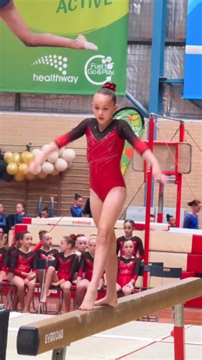 A beautiful back walkover from Ava’s National Level 5 beam routine at Junior State Champs ❤️🖤 #ActiveGymmastics #GymnasticsWA #Gymnastics | Active Gymnastics