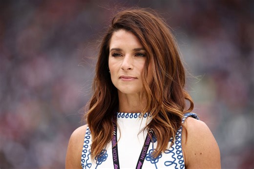 Danica Patrick flaunts upper body workout in teal and navy blue ensemble