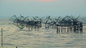 Traditional Thai fishing devices at Thale Noi Lake. Large fishing nets and seines on a swampy lake in Phatthalung province of Thailand. Wetland Plain, Wild Bird Sanctuary in Southeast Asia