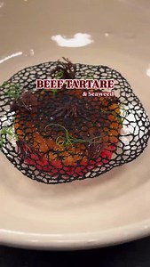 Beef tartare with ponzu-infused tapioca pearls and seaweed emulsion Created by head chef @mikeroox at @restaurantno.2 Always great to see our cutter set in action — this time in the skilled hands of @mikeroox. #beef #tartare #ponzu #tapioca #pearls #emulsion #seaweed #tuile #restaurant #lunch #dinner | Simplistic Food