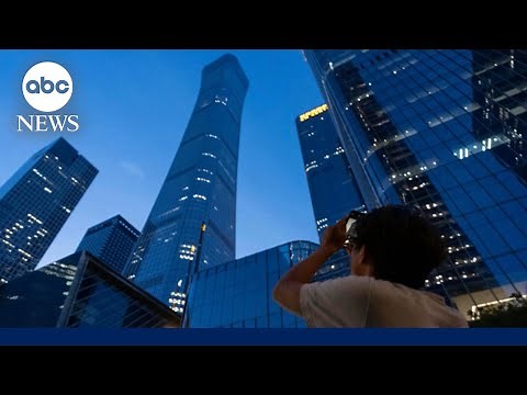 Plane slams into Beijing's tallest building, sends debris raining down onto streets