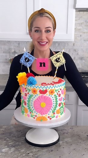 Mexican Emboridery Themed Cake 👇 💕Here she is! The sister to the piñata cake from a few days ago! I was definitely more nervous about this one! I haven’t done a design like this before and I was worried the plan in my head wouldn’t turn out as hoped. WRONG! I love it! OMG it was exactly what I was imagining! I just started in the center and went around each side, matching the mirror image of each design the best I could. I didn’t originally plan on going completely around the cake but I was ha