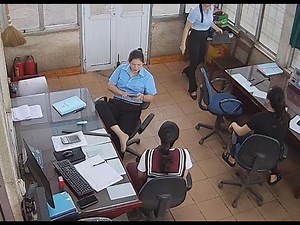 The office lady in blue uniform remove heels relax her tired feet