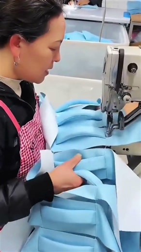 the process of sewing a cloth using a sewing machine to join it together#sewing