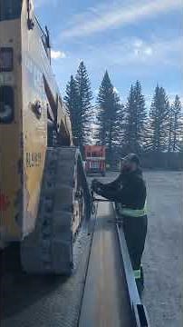 Loading a Cat skid steer with forks and a bucket