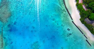 Detailed top view of sea bottom with corals and rocks under turquoise lagoon water in Malaysia islands