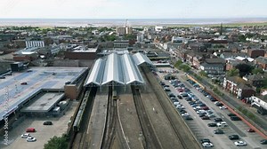 Southport, Lancashire, UK, June 19, 2023; aerial orbital clip video footage of the train and railway station in Southport, England