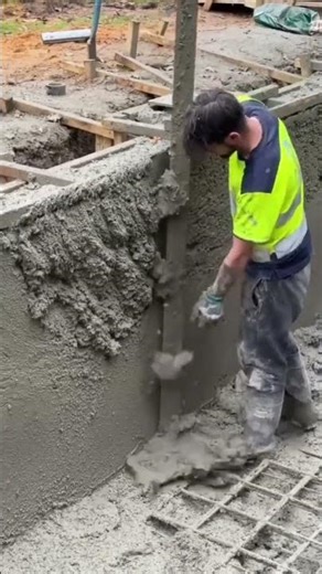 the process of leveling the cement mixture on the walls of a swimming pool using simple tools #short