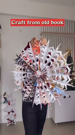 Art by Shabnam on Instagram: "Craft from old book 📕 You can use any book size , old notebook or newspaper cuttings . 3D Snowflake ❄️ from old book papers / paper craft idea 3 D star for Christmas decorations / wall decor / wall hanging / #christmasdecorations #christmascraft #diy #reels #craft"