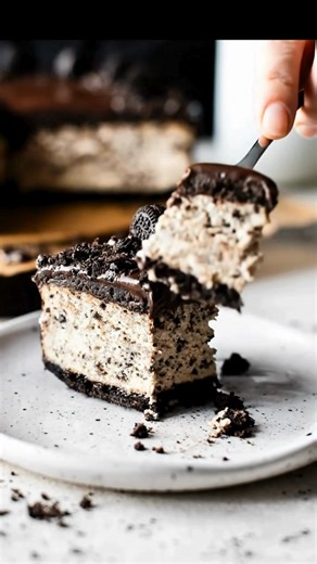 This Oreo Cheesecake is the ultimate cookies-and-cream fantasy! A rich, velvety cheesecake loaded with crushed Oreos, sitting on a chocolate cookie crust and topped with even more cookie goodness. #OreoCheesecake #CookiesAndCream #CheesecakeLovers #OreoDessert #ChocolateLovers #DessertReel #SweetTreats #HomemadeDessert #FoodieFavorites #DessertGoals #IndulgentEats | Chef Paula's Kitchen