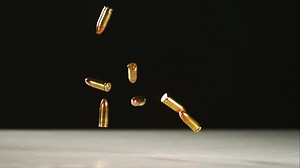 Download Bullets falling and bouncing in ultra slow motion 1,500 fps on a reflective surface - BULLETS PHANTOM 005 for free
