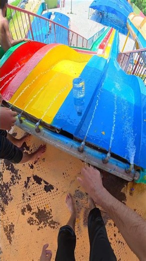 Bottle flip, epic blue slide race, and a high-five in the pool! #shorts #viral #foryou #waterslide