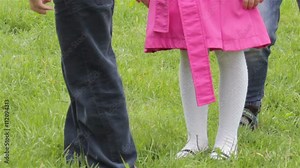 Children's feet in the grass/Children elevate feet on grass