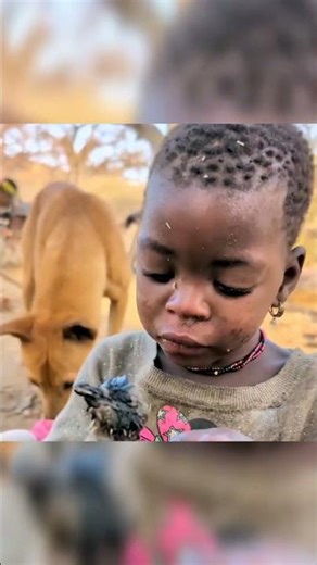 African Tribal Child Enjoying Traditional Roasted Bird! #africa #villagelife #wildlife