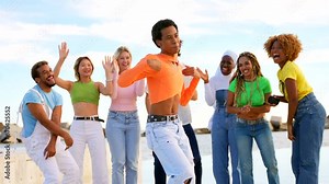 Transgender person dancing happily with multi-ethnic friends Stock Video