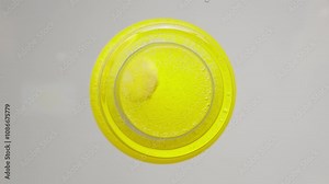 Effervescent vitamin tablet dissolving in water, bubbling with refreshing fizz