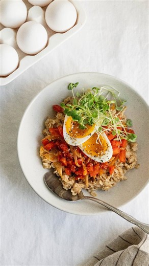 Savory high protein oatmeal bowl with veggies and jammy egg