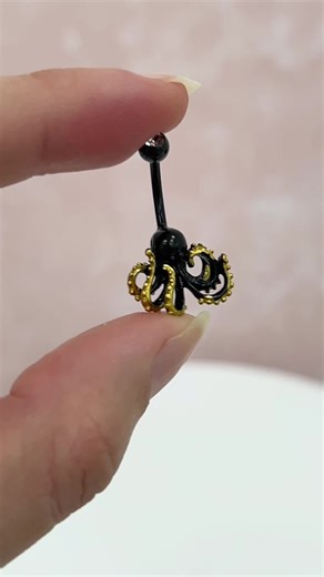 Unleash the deep sea vibes with our Octopus Belly Button Ring! Crafted from Black PVD Surgical Steel, this 14G Kraken-inspired belly ring is both striking and durable. Perfect for navel piercings, the 3/8