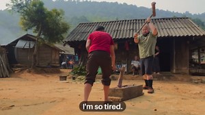 Hmong cooking inside a war relic in rural Laos