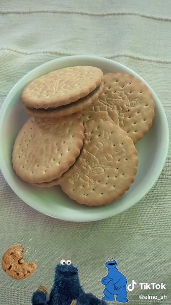 Playful Blue Character Interacts with Cookie