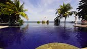 Luxury hotel near the sea. Luxurious open air swimming pool at resort.