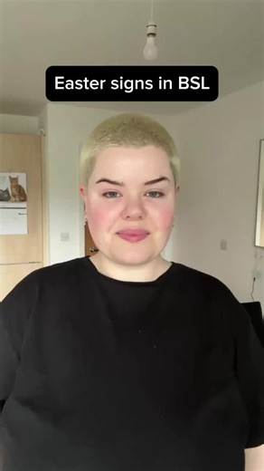 Lingvano | Learn Sign Language on Instagram: "Hop into Easter with some fun BSL signs!⁠ Let’s celebrate with signs full of springtime joy! 🌸✋⁠ What’s your favorite Easter sign?🐣✨ ⁠ ⁠ Image Description: A person with short blonde buzzcut hair is wearing a black sweater. In the background, there are white walls, a door, and a visible shelf.⁠ ⁠ #BSL #EasterSigns #LearnBSL #SignLanguageFun #AccessibleCommunication⁠ ⁠"