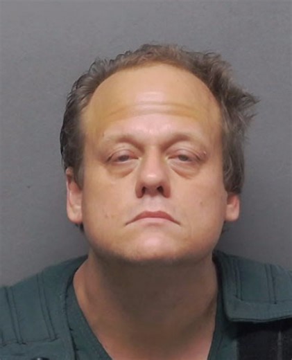 Man who lived with wife's corpse for month charged with murder
