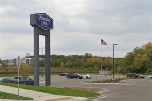 Crane removes Hilton sign at hotel accused of denying entry to ICE
