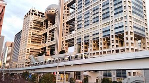 Fuji TV Building in Minato district at sunset. Odaiba, Japan.