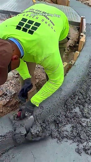 The process of manually forming and smoothing a concrete curb