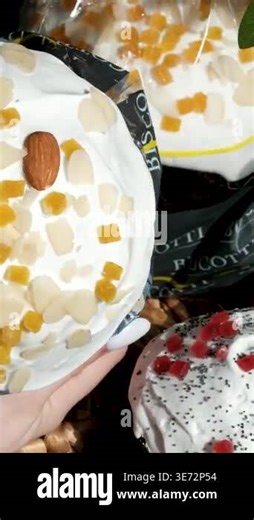 Three Easter breads paska kulich and panettone on a table as female hands gently tear soft crumb revealing airy texture with candied fruit and almond flakes. bright natural light Stock Video Footage - Alamy