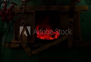 Steam train's furnace opens and closes.