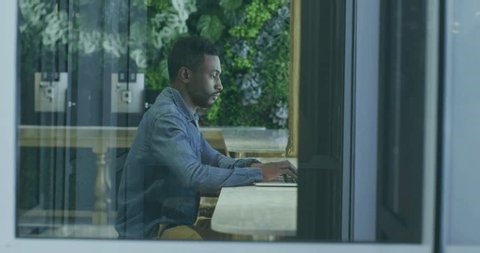 clip-4008496663-male-developer-touching-laptop-keyboard-initiating-coding