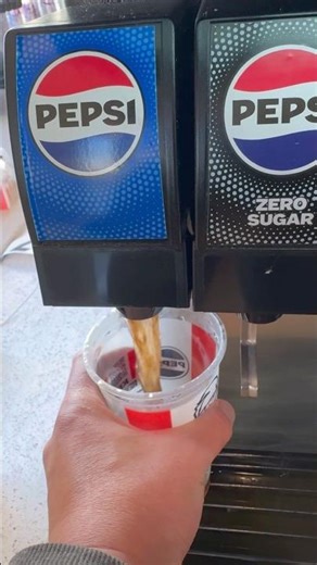 Pepsi soda drink refill at KFC Kentucky, fried chicken and soda fountain machine