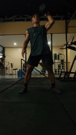 Single-Arm Dumbbell Overhead Squat with a Floor Tap